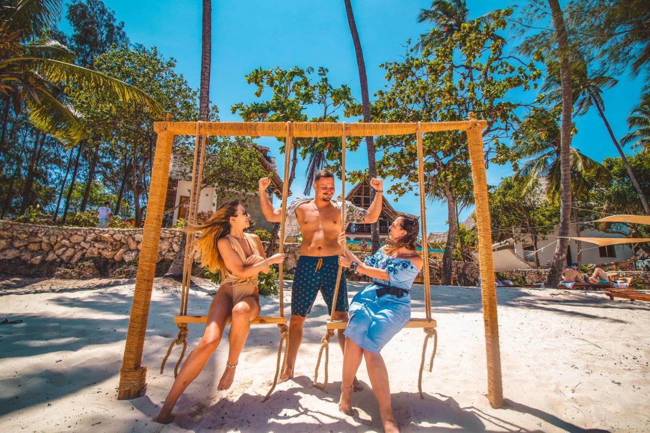Zanzibella Hotel & Spa Kiwengwa  Kültér fotó Swinging at the beach